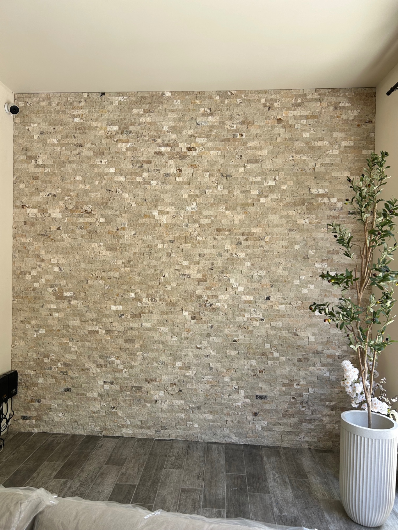 Finished stacked stone accent wall installation
